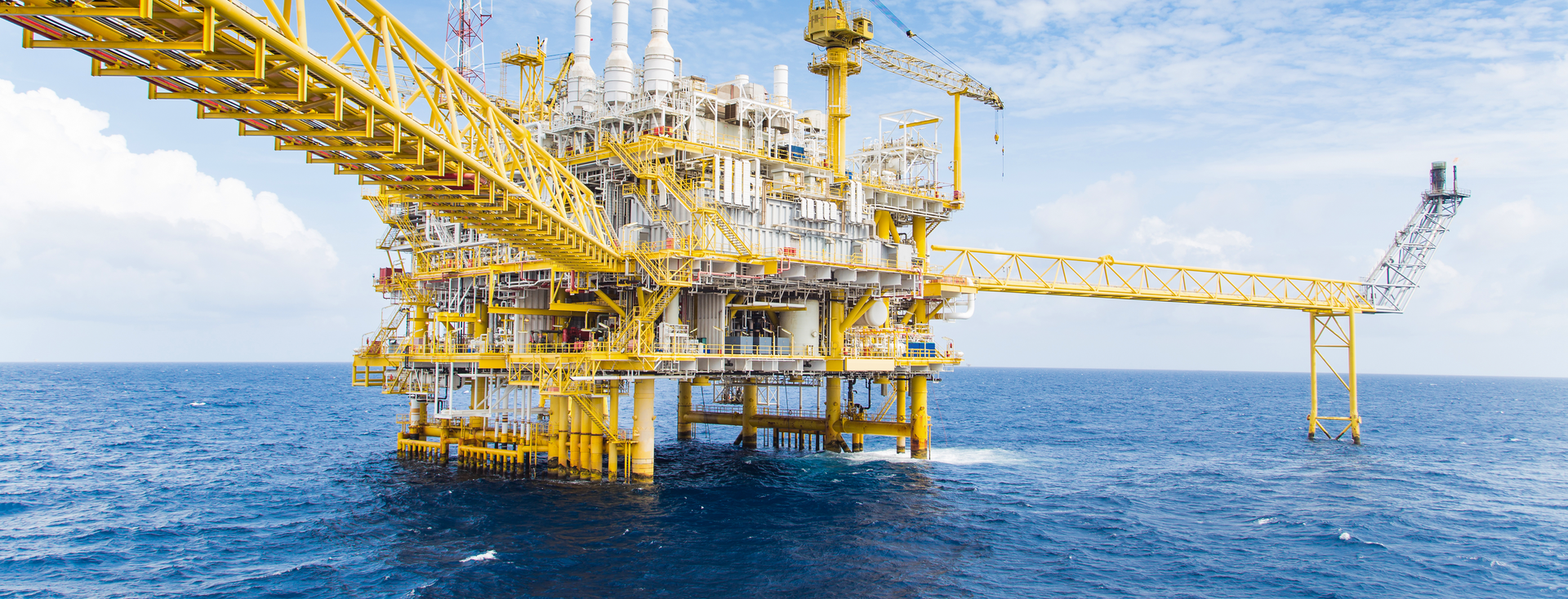 yellow and white offshore drilling platform